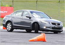 Stability at ease - Accord 3.5L turning at the 'Half Circle' test during the Skid Control in  Advanced Driving category.