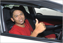 Mr. Amirul Imran bin Amirin, giving the thumbs up while waiting for his turn to go on track.