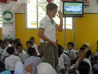 Students interacting excitingly with invited speaker on environment, Ms. Daisy Poh.