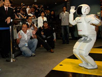 ASIMO dancing with the crowd.