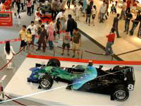 Shoppers finding out more about the Honda Racing F1 roadshow in Penang
