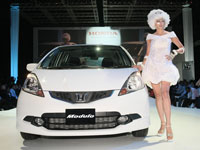 Taffeta White All-New Jazz with Modulo accessories together with a model showcasing a design piece from Khoon Hooi (Themed 'Space')