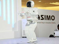 ASIMO's capability of carrying a tray while walking.