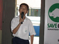 Standard 5 student Aaron Lim Pek Qin, 11, sharing his thoughts on the environment with his schoolmates.