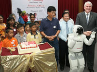 ASIMO celebrates the fund 20<sup>th</sup>  Anniversary with the beneficiaries by singing them a Happy Birthday song.