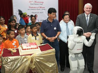 ASIMO celebrates the Heart Patients' Fund 20<sup>th</sup> -anniversary with the beneficiaries by singing them a Happy Birthday song.