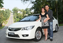 Michelle Lu and husband Jack Ma with their Civic Hybrid - They purchased the car because of its environment-friendly technology and fuel efficiency.